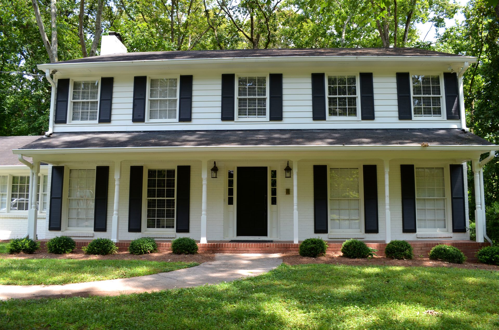 Front exterior of 785 Spalding Drive - classic colonial with covered porch